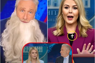 KAROLINE LEAVITT HUMILIATED BY JON STEWART — AND JUST DAYS LATER, SHE TOOK OFF HER CROSS NECKLACE. She finally ditched her signature necklace this week—right after Stewart torched her live on The Daily Show2.